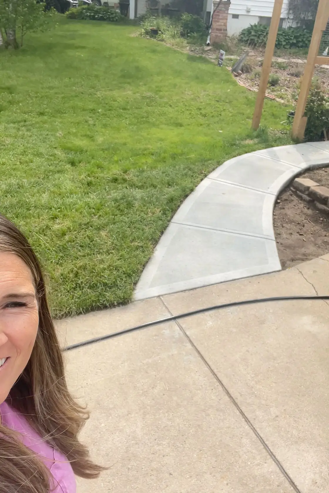 Finished area of our side yard where we added sod for a new lawn.